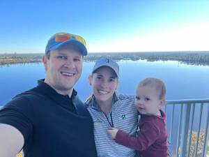 Katherine Perry-Hamski with husband and caddie Kevin and son John.